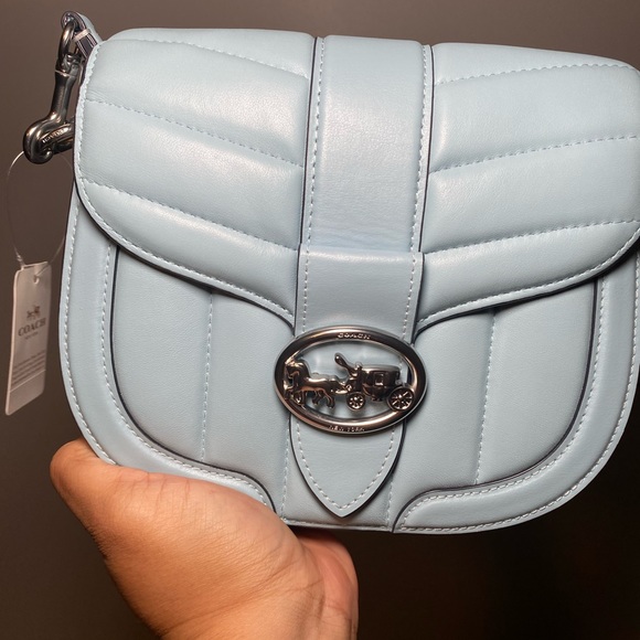 Pretty light blue Coach handbag … small interior … great leather .. very cute